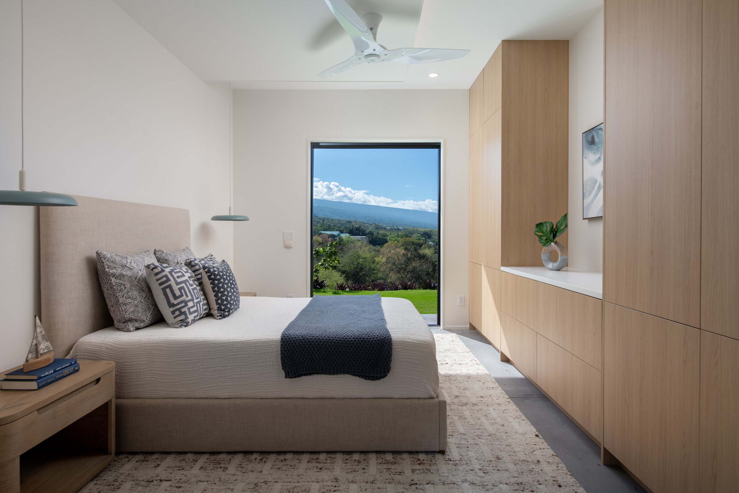 82-5879 Government Main Road Captain Cook, HI 96704 - Photo 13 of 30 a bedroom with a bed and glass window