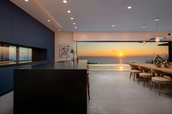 a spacious bedroom with a large bed and a large window