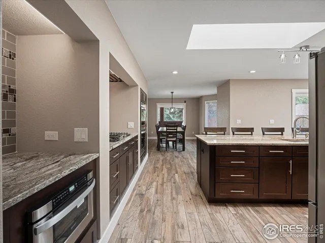 a kitchen with a wooden cabinets and counter space