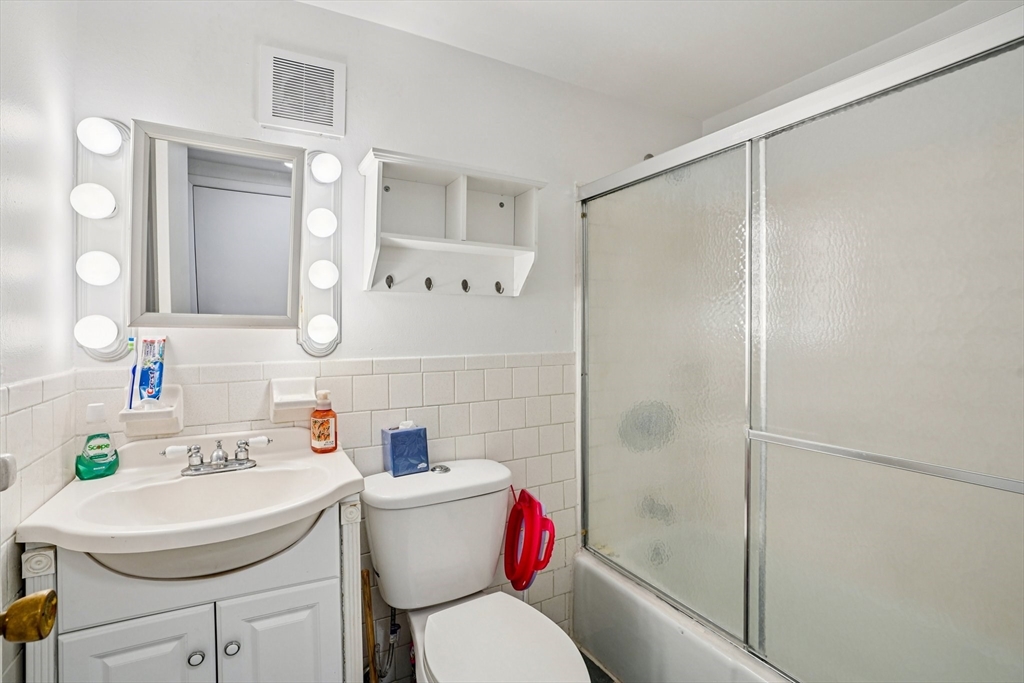 208 Swanson Road, Unit 526 Boxborough, MA 01719 - Photo 12 of 18 a bathroom with a sink toilet and shower