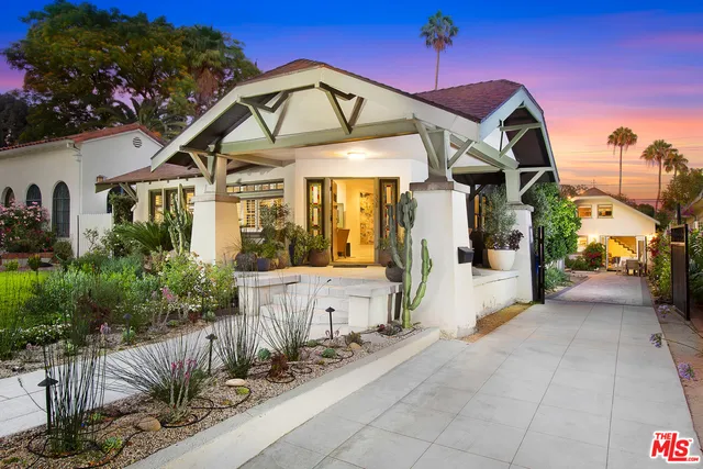 a view of a house with large windows