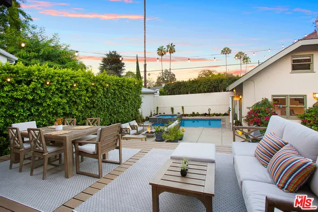 a view of terrace with seating area and roof