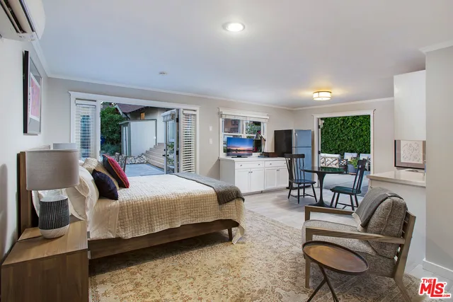 a bedroom with furniture and a couch