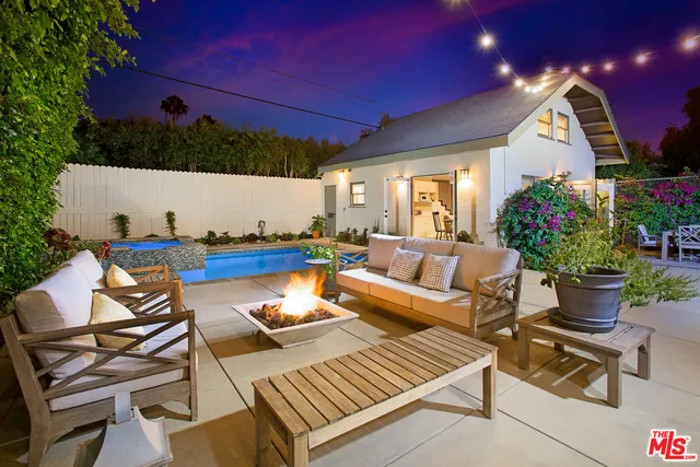 a outdoor living space with furniture and a potted plant