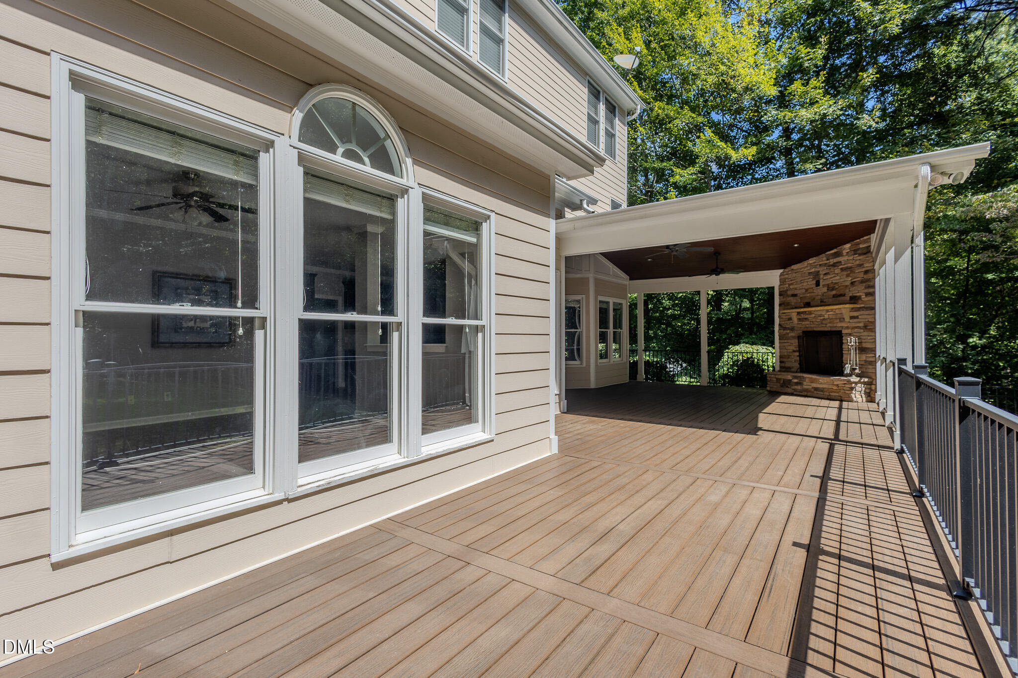2729 Sunnystone Way Raleigh, NC 27613 - Photo 28 of 37 Custom Covered TREX Deck & Outdoor Fireplace