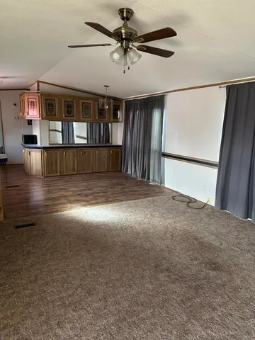 a view of a bathroom with a sink and a mirror