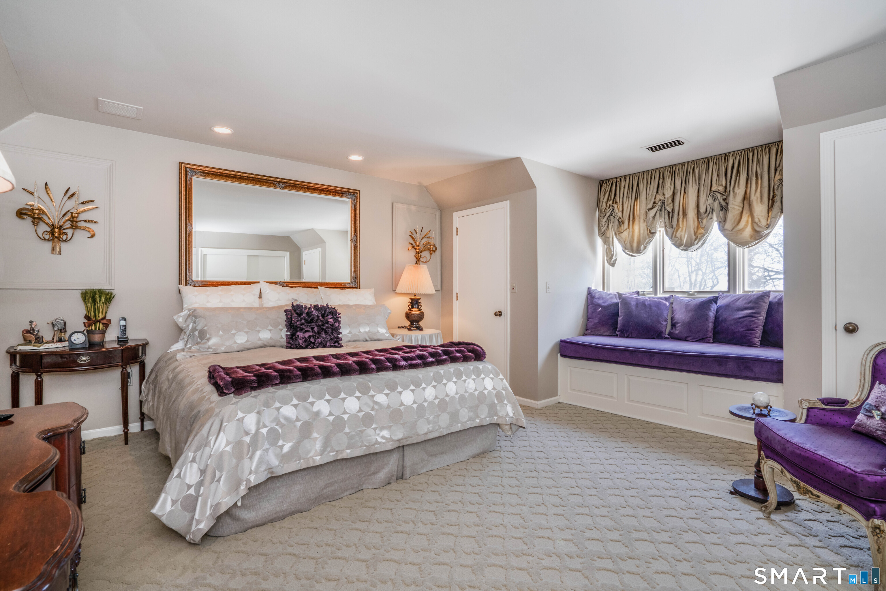 33 Mountain Farms Road West Hartford, CT 06117 - Photo 21 of 38 a spacious bedroom with a bed and a couch