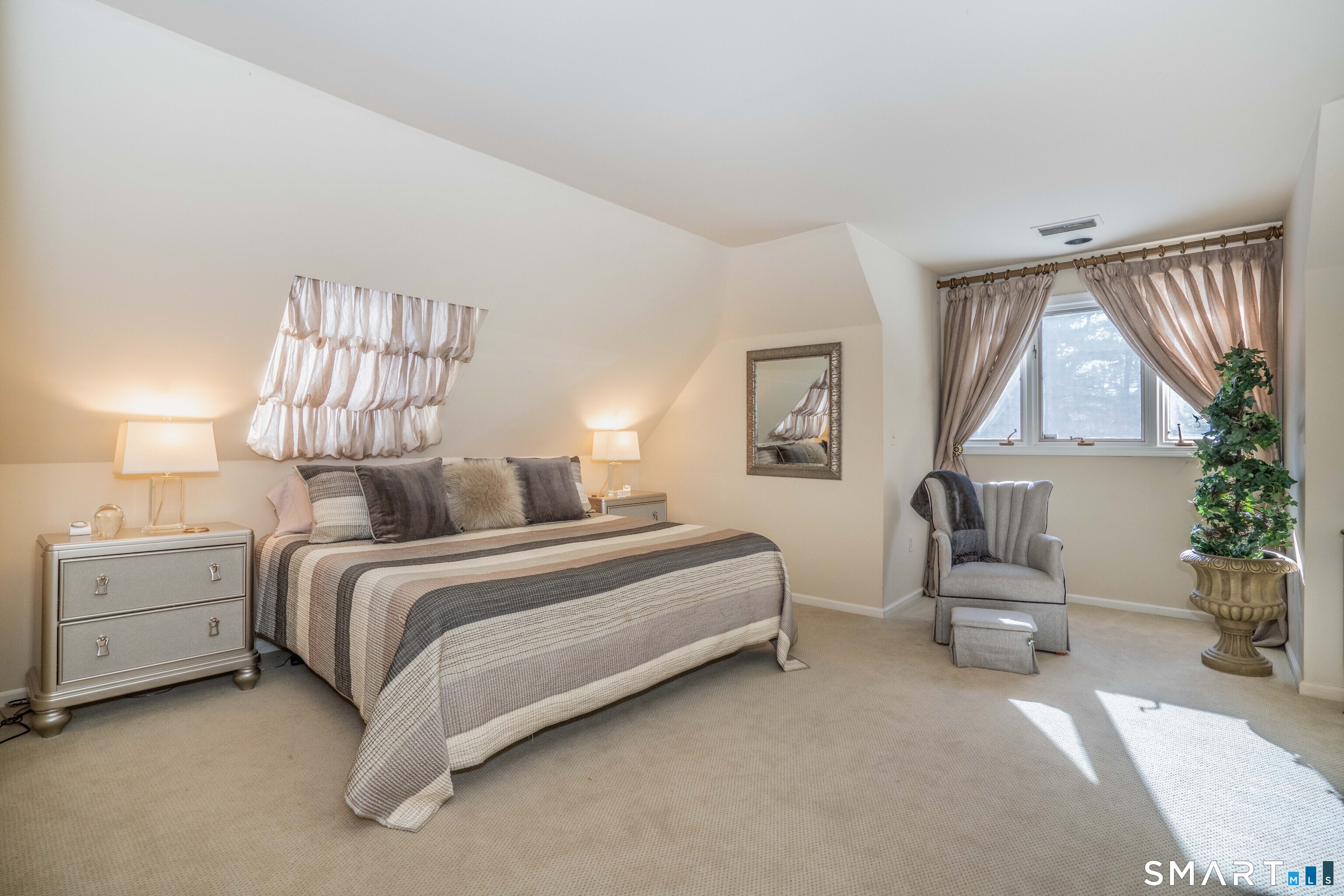 33 Mountain Farms Road West Hartford, CT 06117 - Photo 22 of 38 a spacious bedroom with a bed and a window