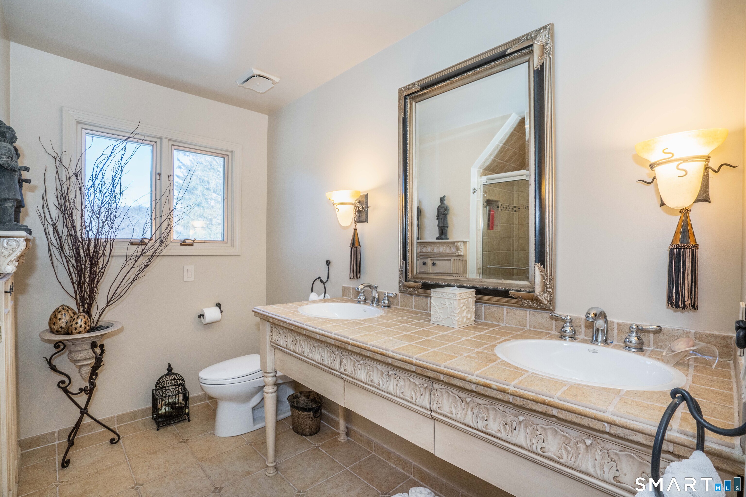 33 Mountain Farms Road West Hartford, CT 06117 - Photo 23 of 38 a bathroom with a granite countertop toilet a sink and a mirror