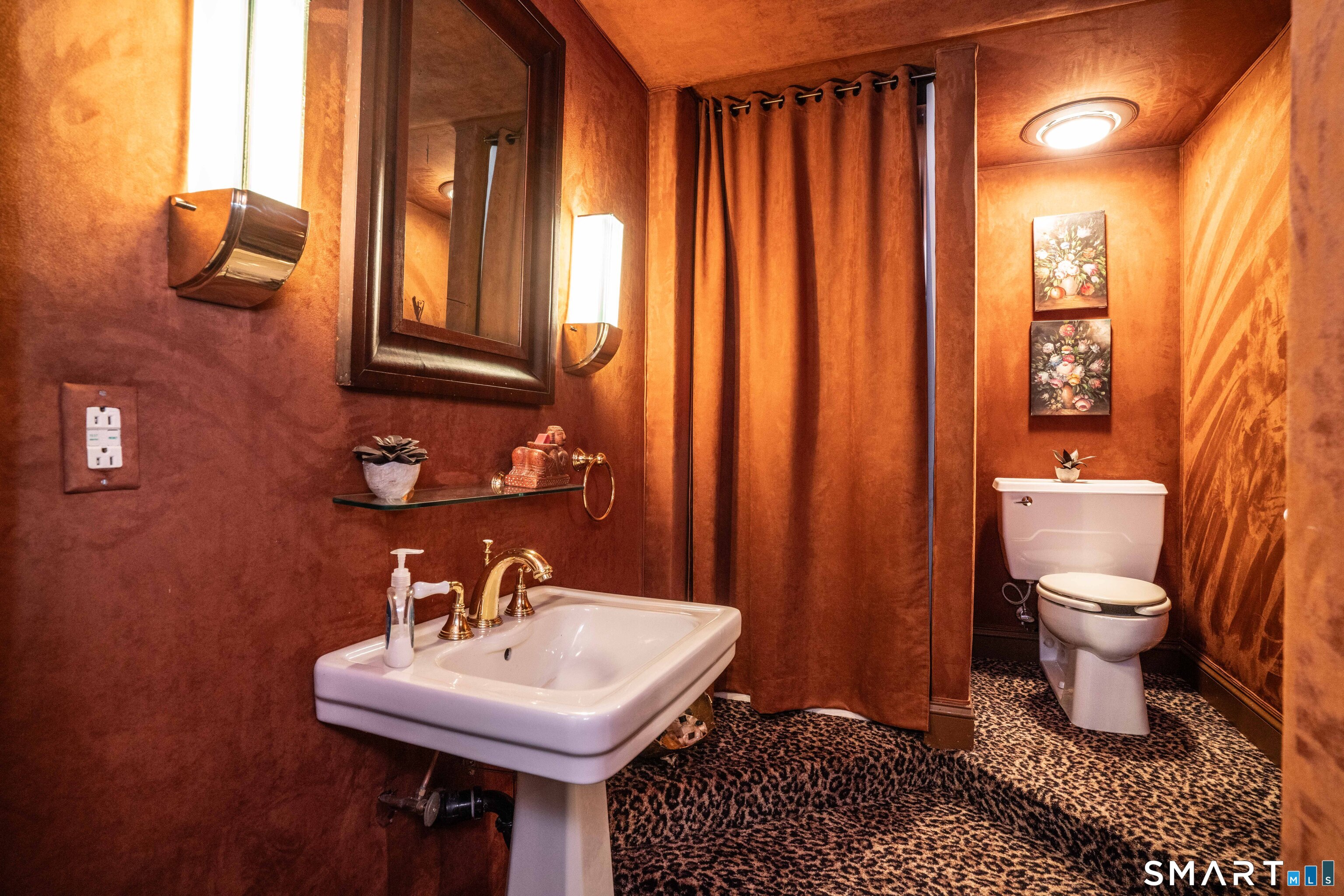 33 Mountain Farms Road West Hartford, CT 06117 - Photo 27 of 38 a bathroom with a sink a toilet and mirror