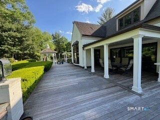 33 Mountain Farms Road West Hartford, CT 06117 - Photo 32 of 38 a view of a house with backyard porch and sitting area