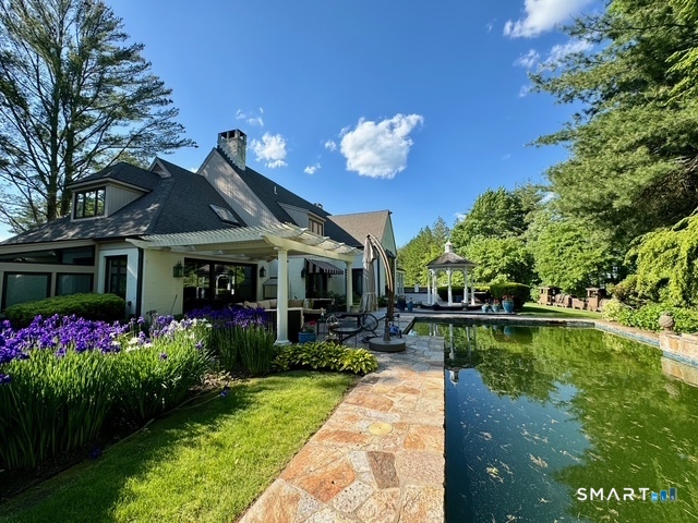 33 Mountain Farms Road West Hartford, CT 06117 - Photo 33 of 38 a front view of a house with garden