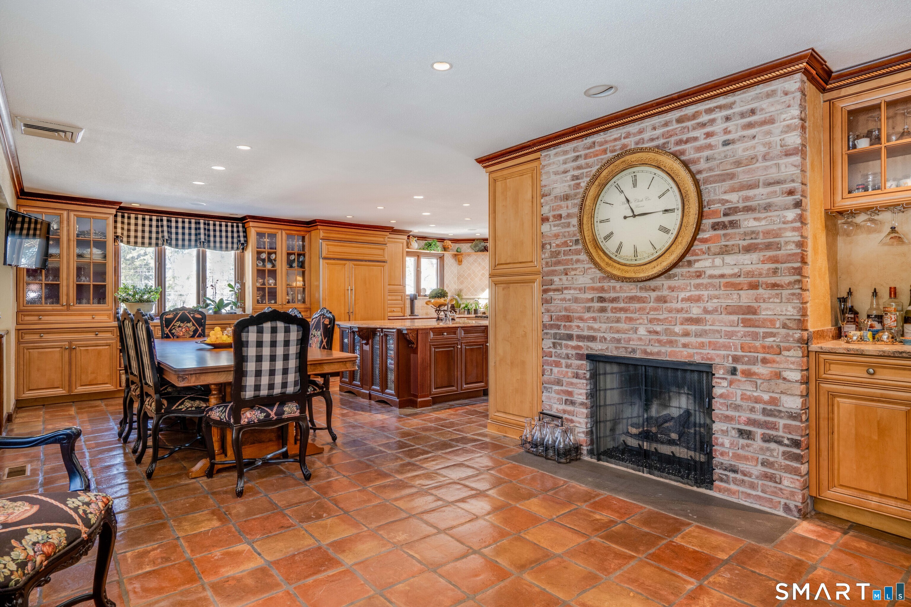 33 Mountain Farms Road West Hartford, CT 06117 - Photo 4 of 38 a living room with furniture a clock and a fireplace