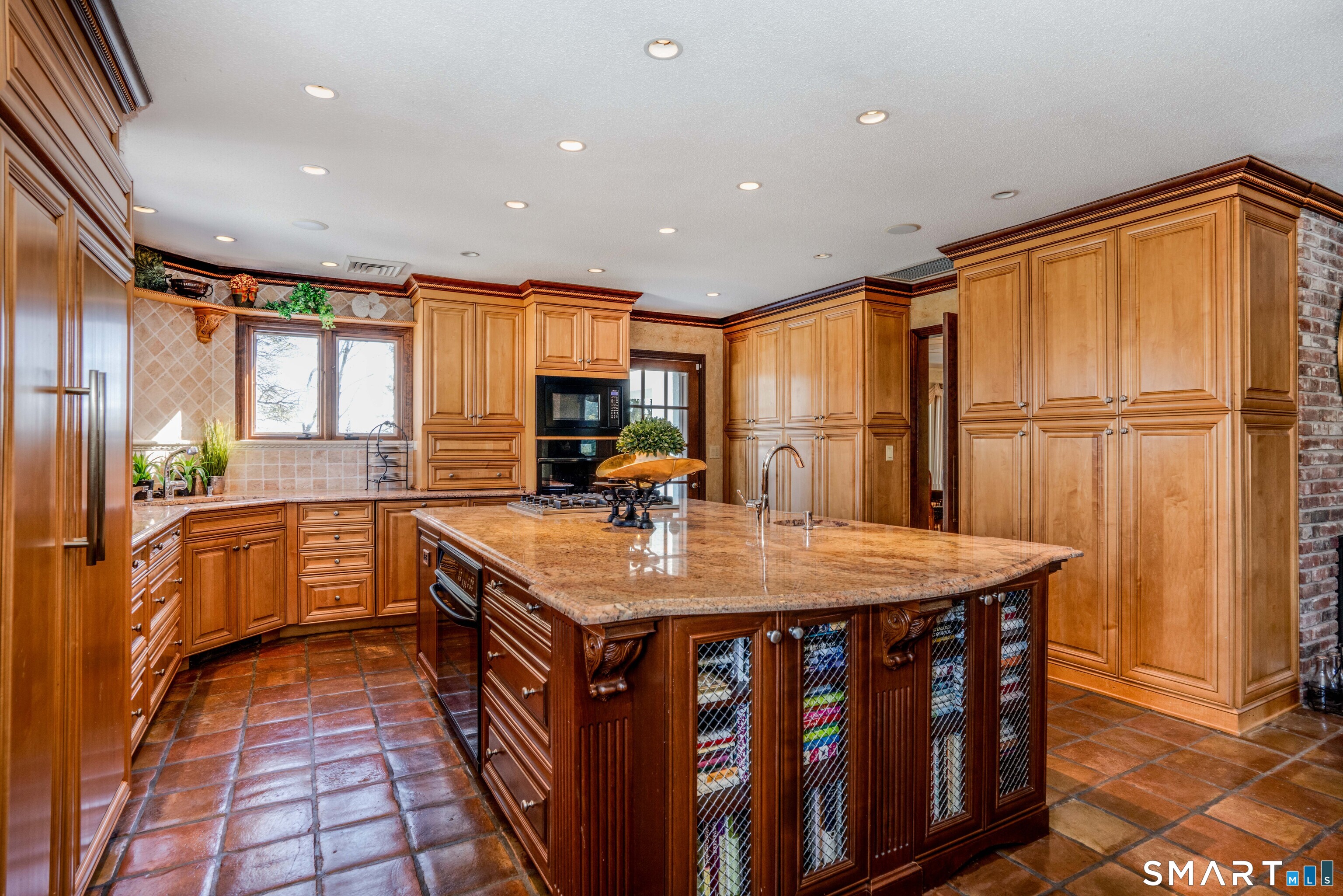 33 Mountain Farms Road West Hartford, CT 06117 - Photo 6 of 38 a kitchen with sink refrigerator and large window