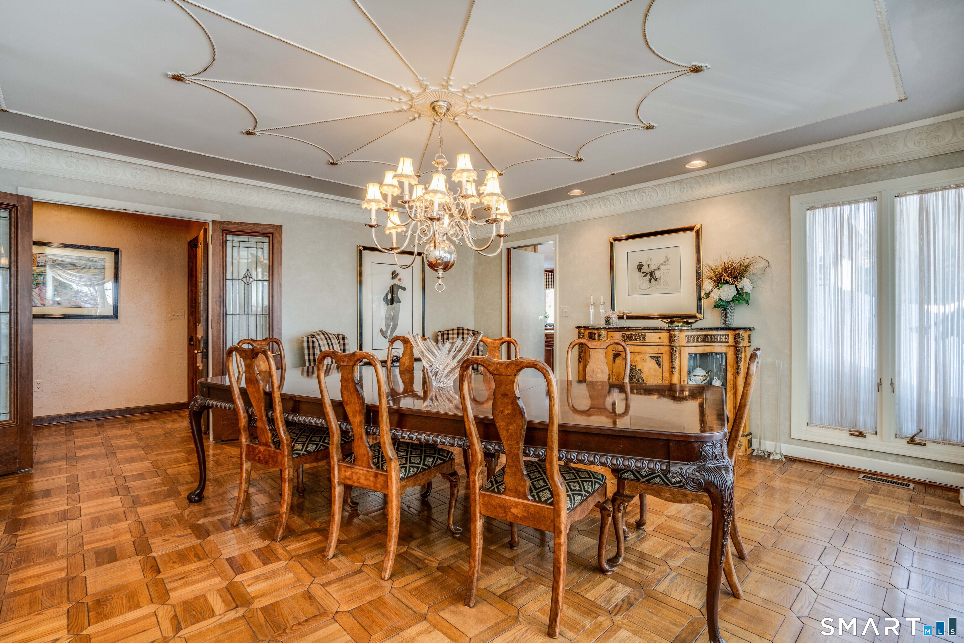 33 Mountain Farms Road West Hartford, CT 06117 - Photo 8 of 38 a view of a dining room with furniture a chandelier and window