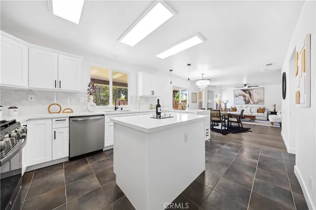 a kitchen with sink cabinets and counter top space