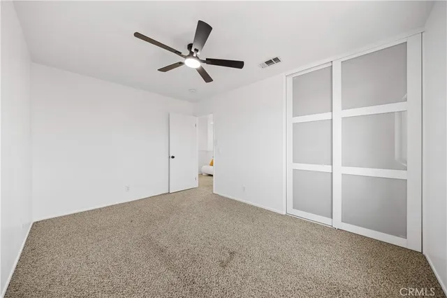 a view of a livingroom with a ceiling fan