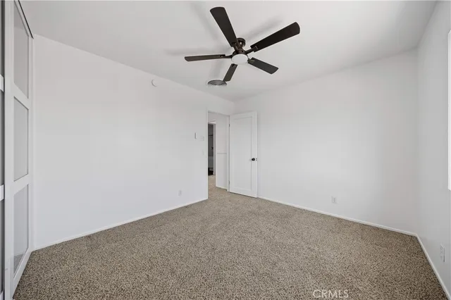 a view of a big room with carpet