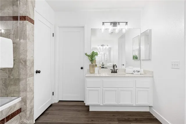 a bathroom with a sink and a mirror