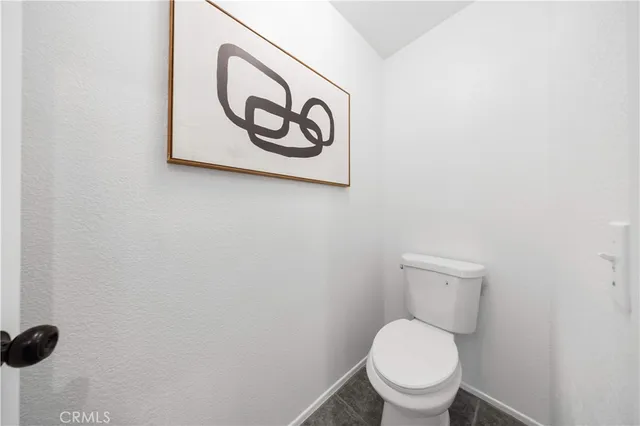 a bathroom with a toilet and a sink