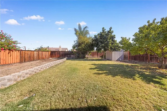 a swimming pool with wooden fence