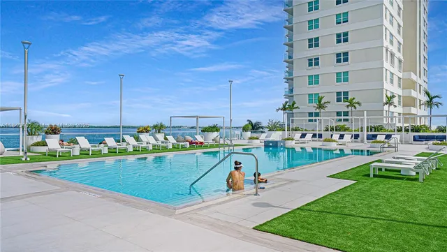 a view of a balcony with yard