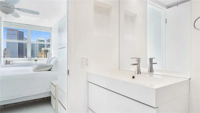 a en suite bathroom with a sink and a mirror