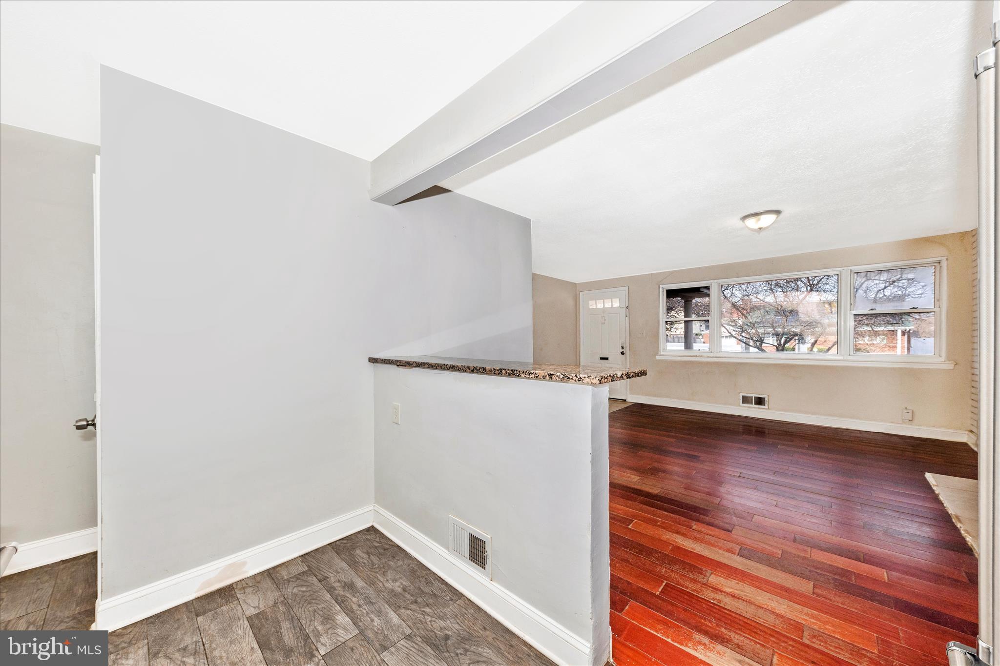 8109 Riggs Road Hyattsville, MD 20783 - Photo 12 of 54 a view of a hallway with wooden floor