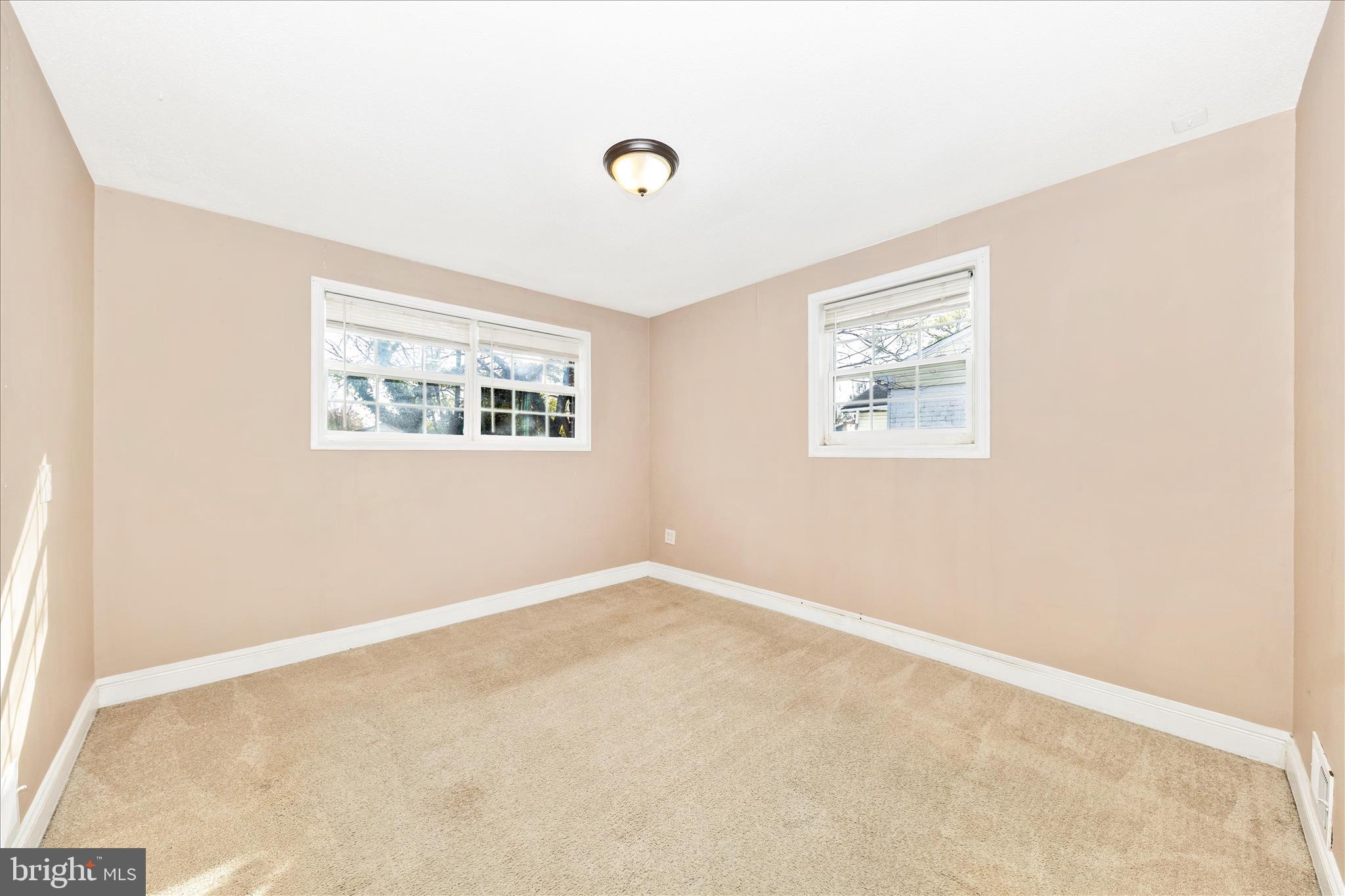 8109 Riggs Road Hyattsville, MD 20783 - Photo 17 of 54 an empty room with windows