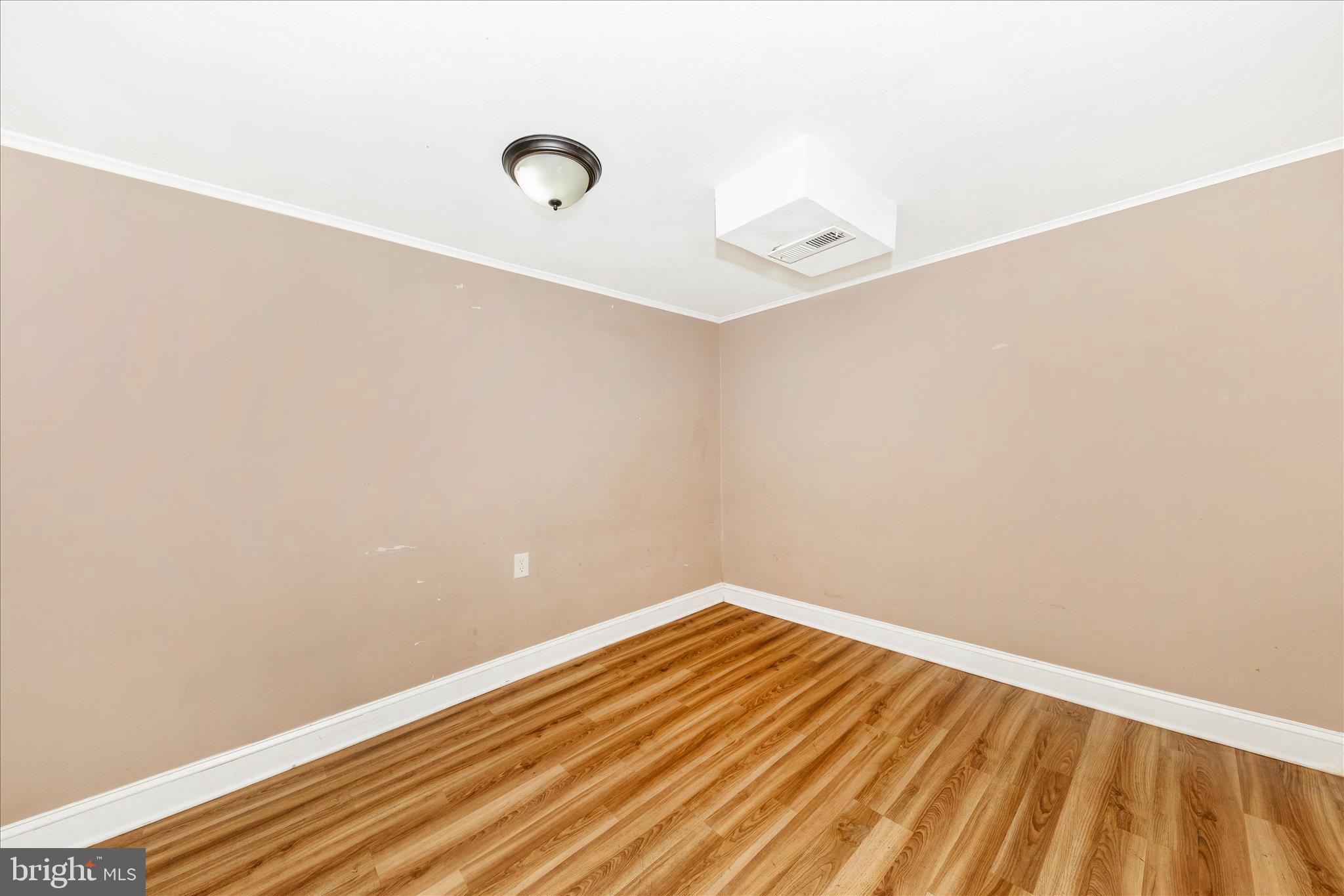 8109 Riggs Road Hyattsville, MD 20783 - Photo 27 of 54 a view of a room with wooden floor