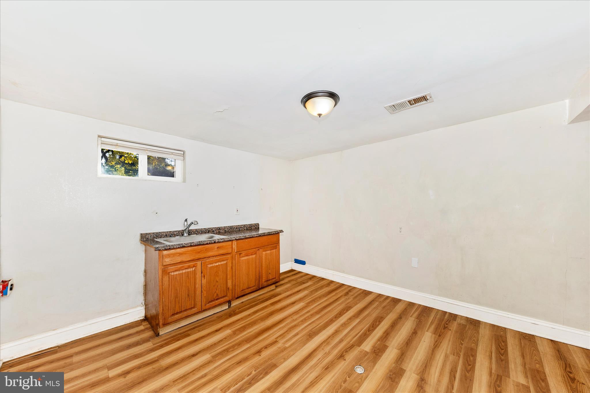 8109 Riggs Road Hyattsville, MD 20783 - Photo 34 of 54 a view of empty room with wooden floor