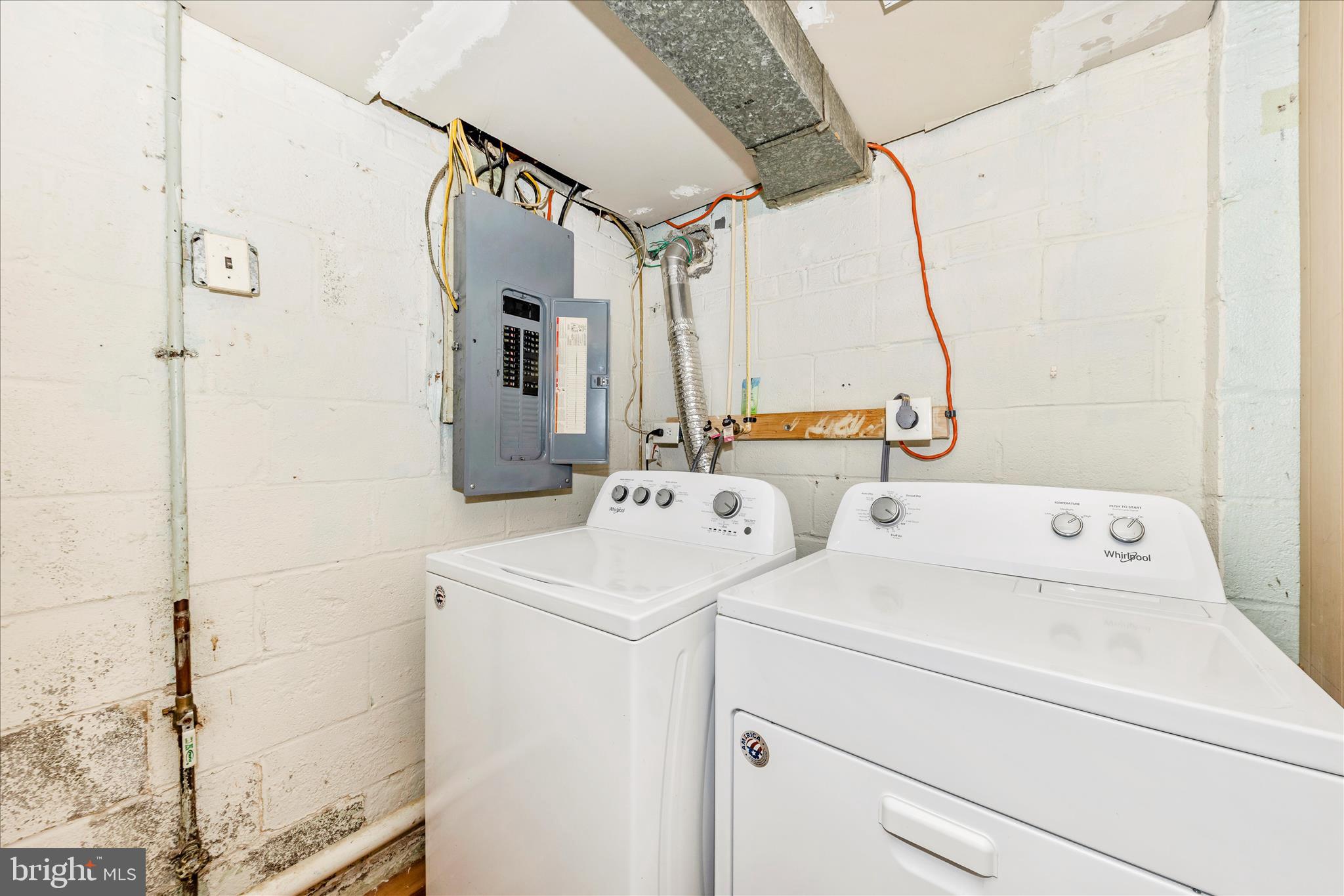 8109 Riggs Road Hyattsville, MD 20783 - Photo 36 of 54 a utility room with dryer and washer