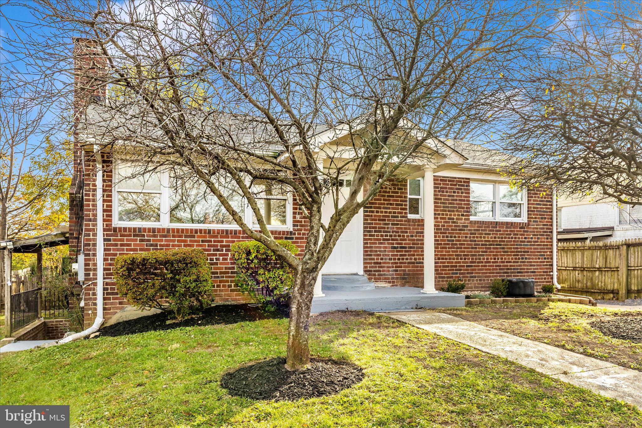 8109 Riggs Road Hyattsville, MD 20783 - Photo 41 of 54 a front view of a house with a yard