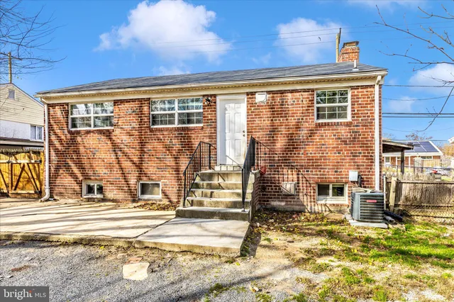 a view of a backyard with a table and chairs