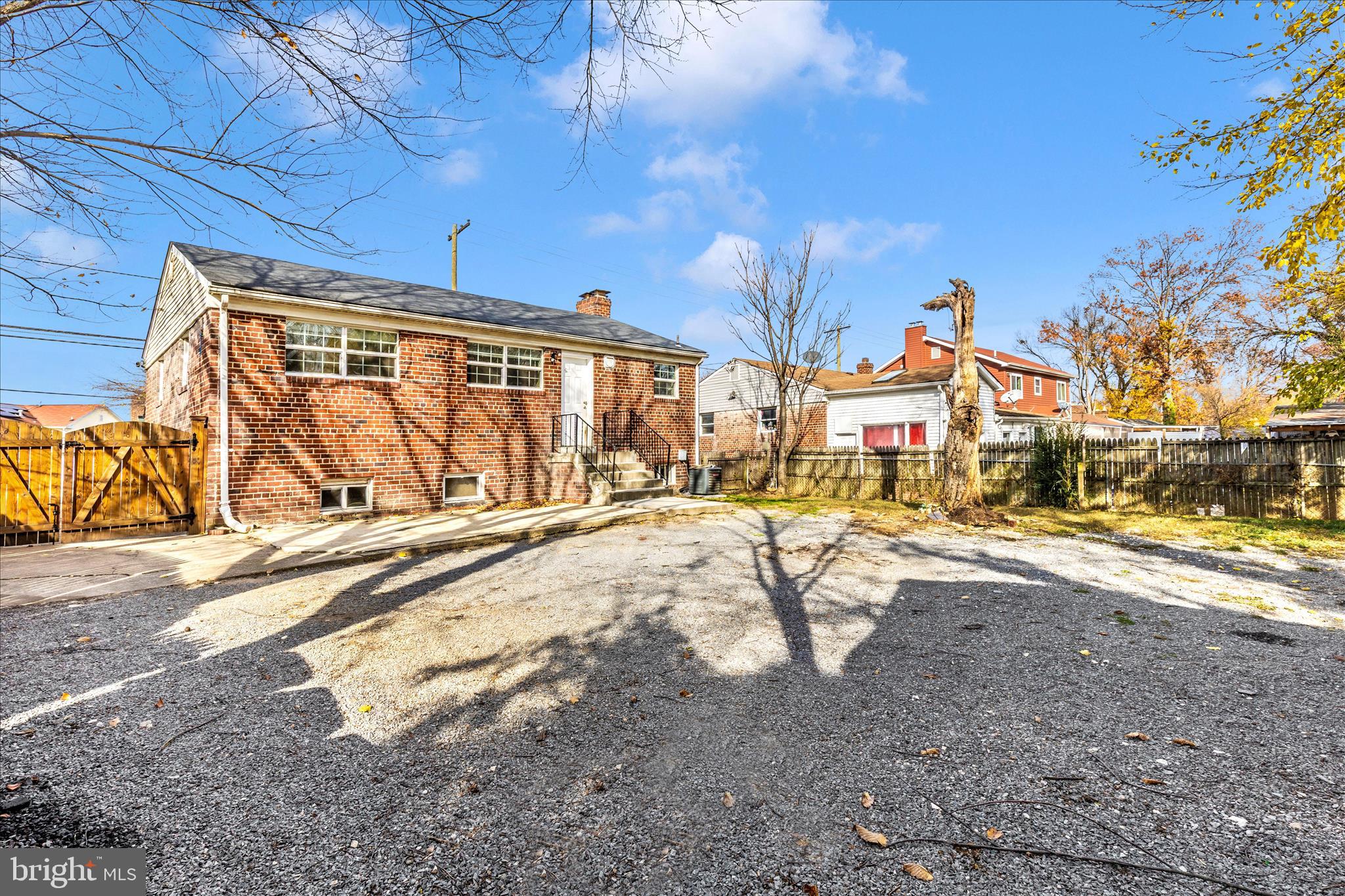 8109 Riggs Road Hyattsville, MD 20783 - Photo 46 of 54 a view of a backyard with a table and chairs