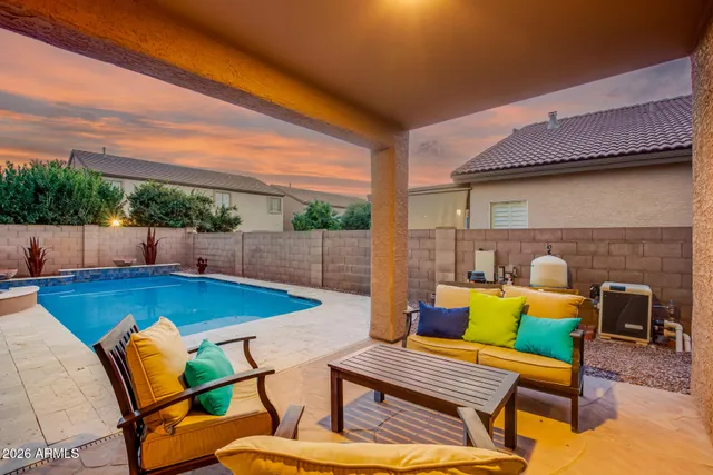 a patio with patio a couch and chairs