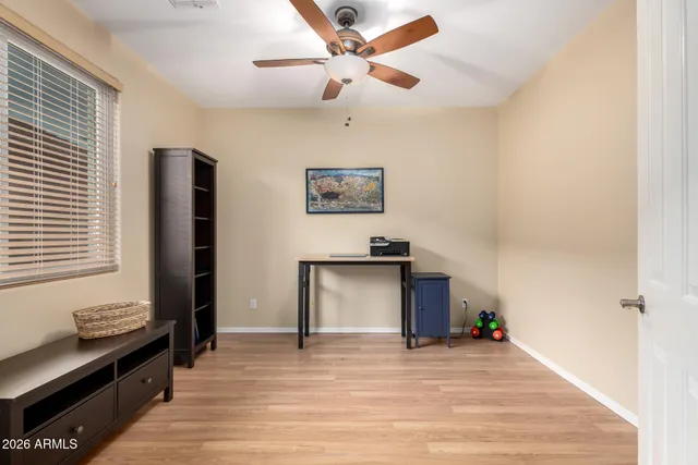 a view of room with window and ceiling fan