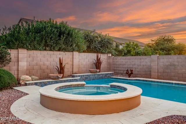 a view of a swimming pool with a yard