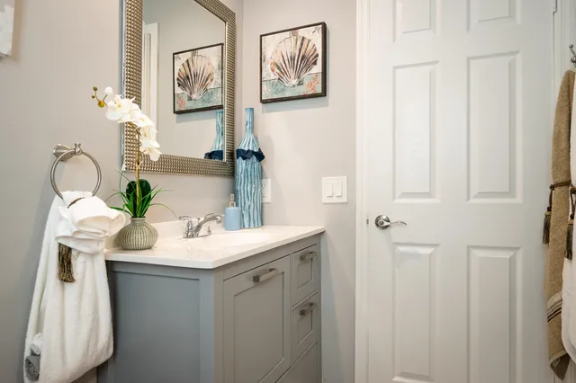 a kitchen with granite countertop a sink stove and cabinets