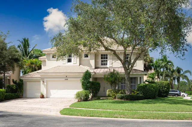 a utility room with sink dryer and washer