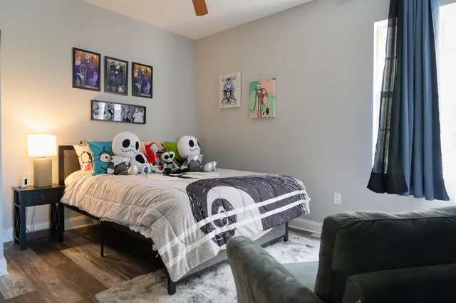 a kitchen with a table chairs stove and cabinets