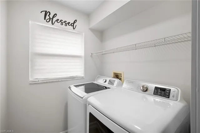 an empty room with a chandelier fan