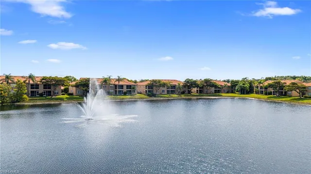 an aerial view of residential houses with outdoor space and river