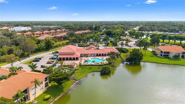 an aerial view of residential houses with outdoor space and street view
