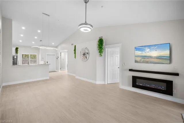 a view of a room with window and ceiling fan