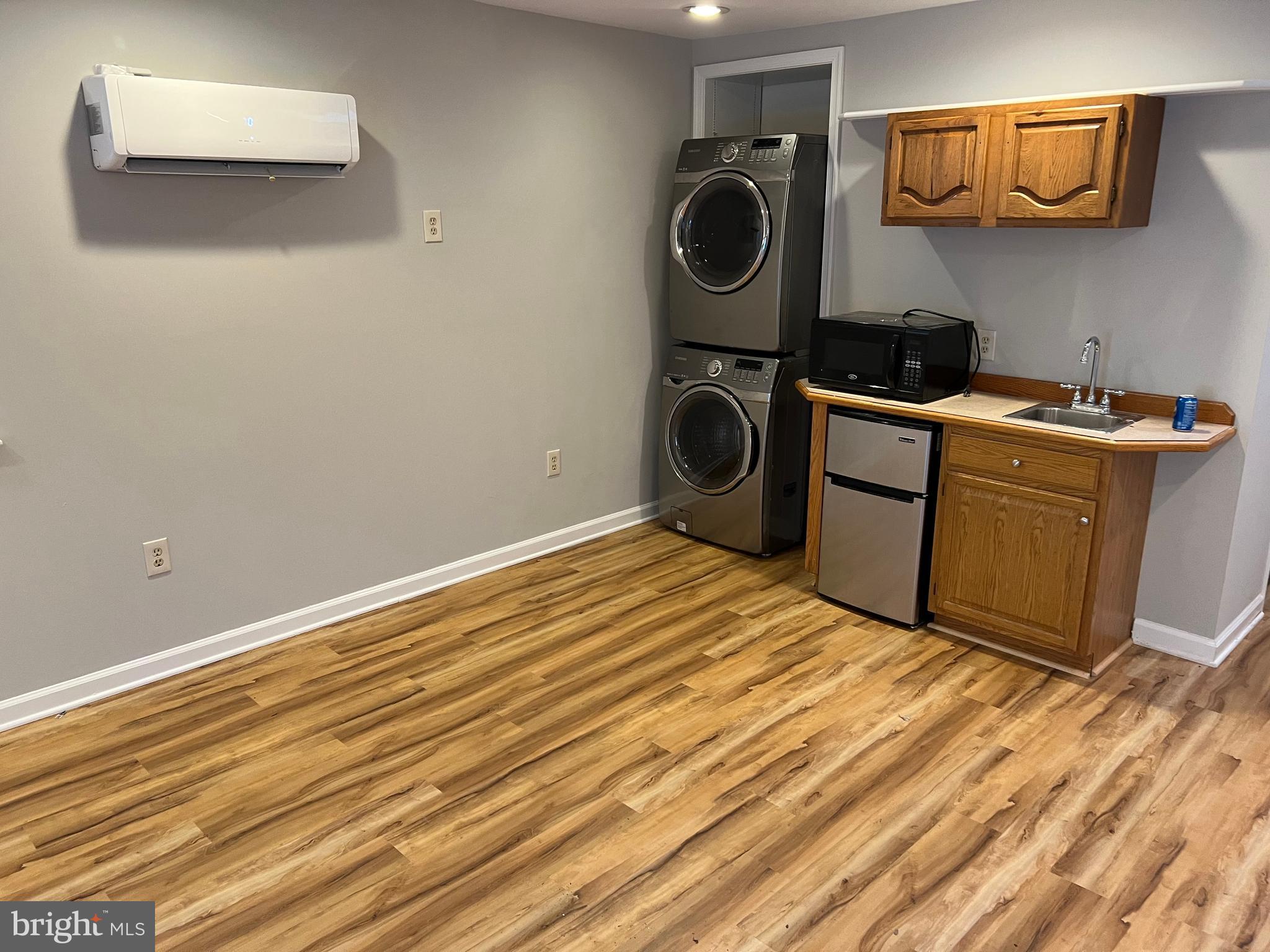 593 A Street Pasadena, MD 21122 - Photo 1 of 8 a bedroom with a bed and cabinets