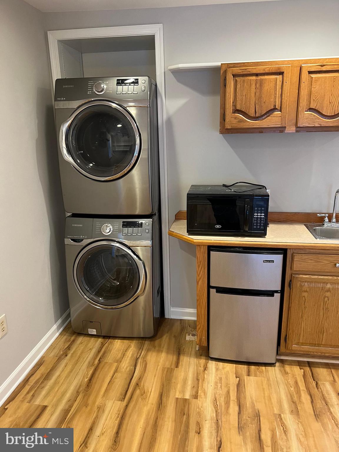 593 A Street Pasadena, MD 21122 - Photo 5 of 8 a utility room with sink dryer and washer