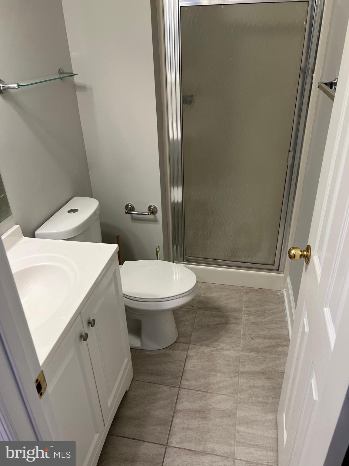 593 A Street Pasadena, MD 21122 - Photo 7 of 8 a bathroom with a toilet and a shower