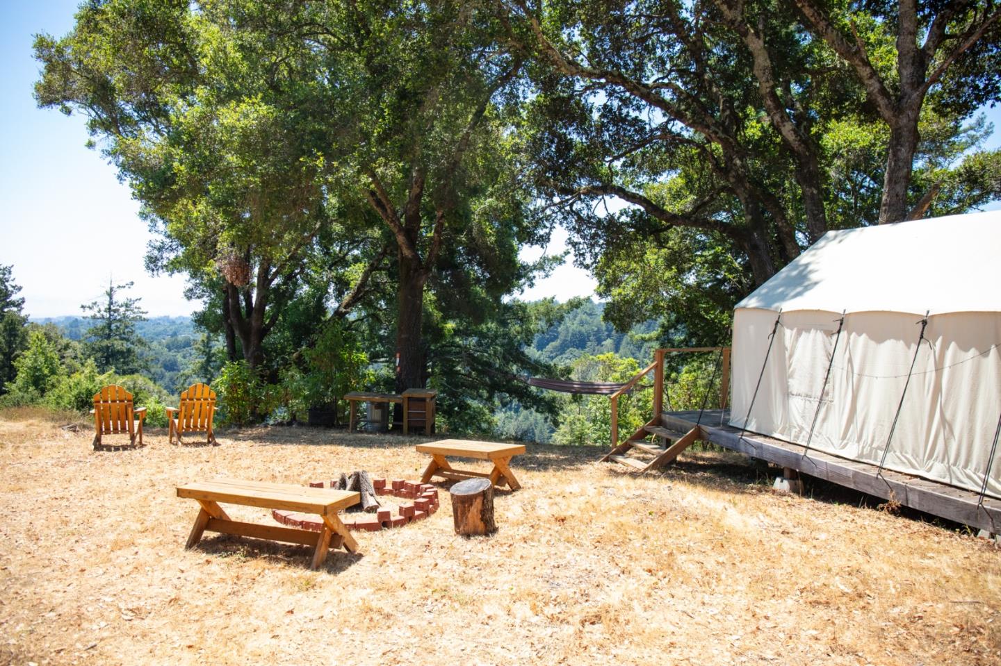 1003 Laurel Glen Road Soquel, CA 95073 - Photo 67 of 101 a view of a backyard with a bench and trees
