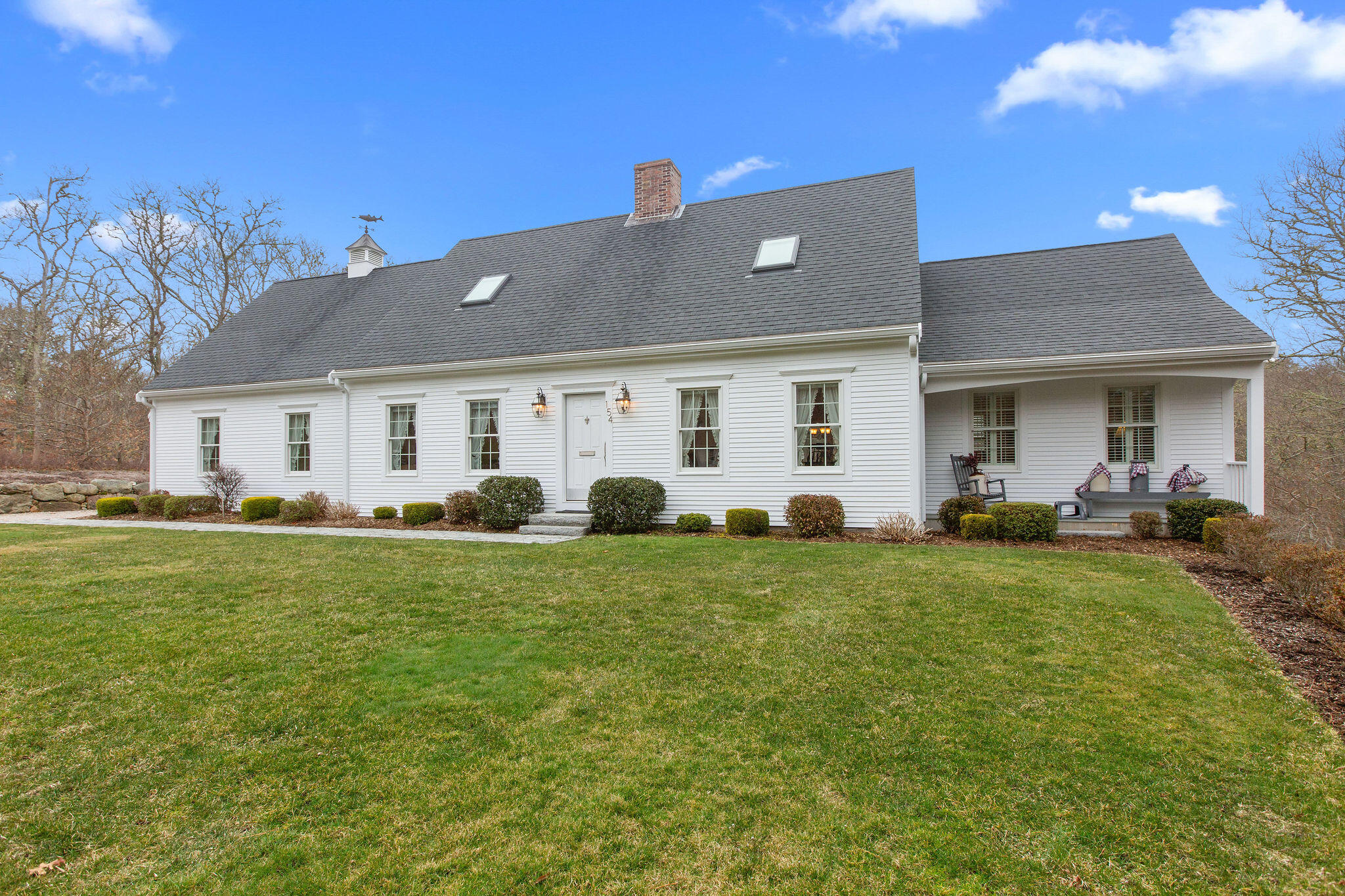 154 Beechtree Drive Brewster, MA 02631 - Photo 1 of 76 a front view of house with yard barbeque and outdoor seating